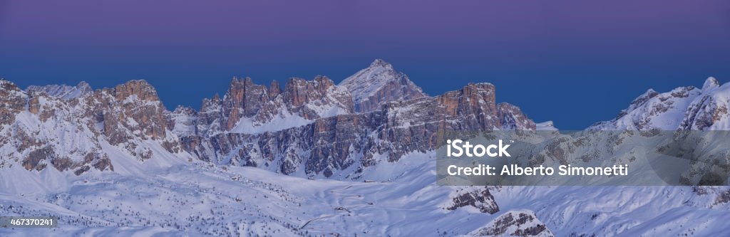 Twilight in the Dolomites Panoramic view of the Giau Pass at twilight. It the background the lofty peak of Mount Antealo (Dolomites - Italy) Aerial View Stock Photo