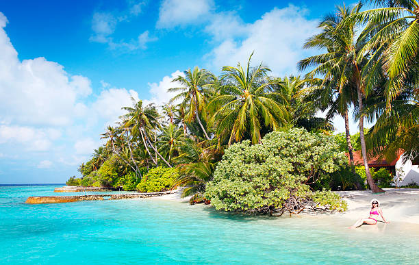 istock Woman relaxing on the beach in Maldives 467372962