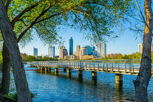 Austin TX downtown panorama skyline cityscape. The Boardwalk Trail at Lady Bird Lake.