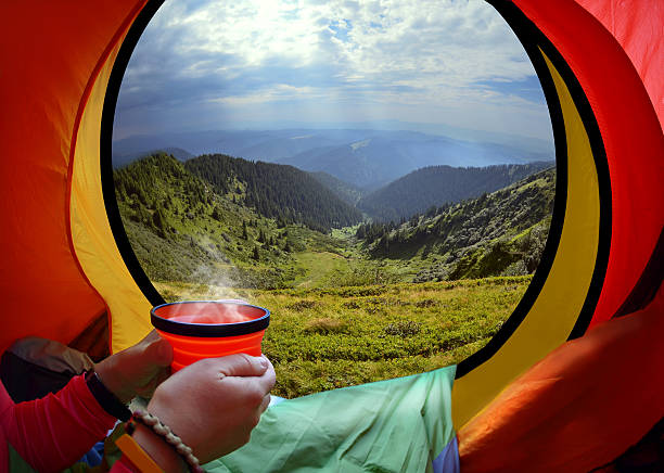 istock Woman lying in a tent with coffee 467379094