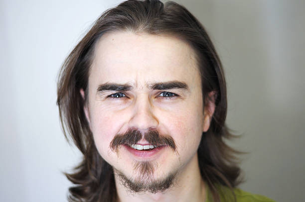 istock Close-up portrait of smiling man with beard 467379278