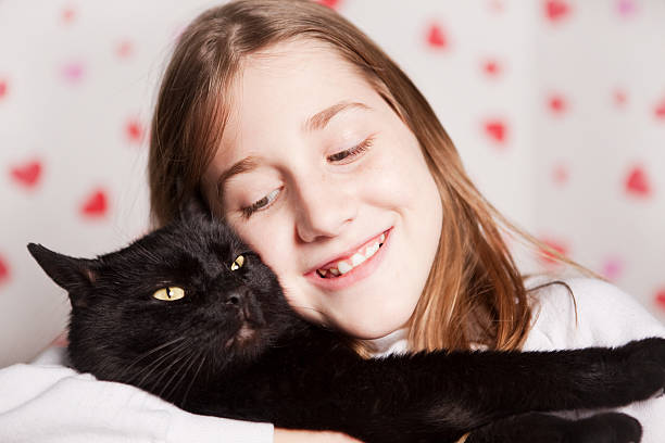 istock Young Girl Hugging Cat 467379363