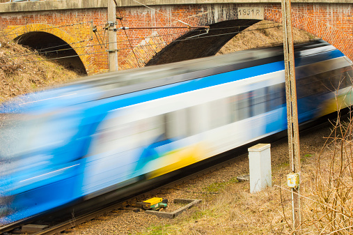 speeding trains glide along the tracks