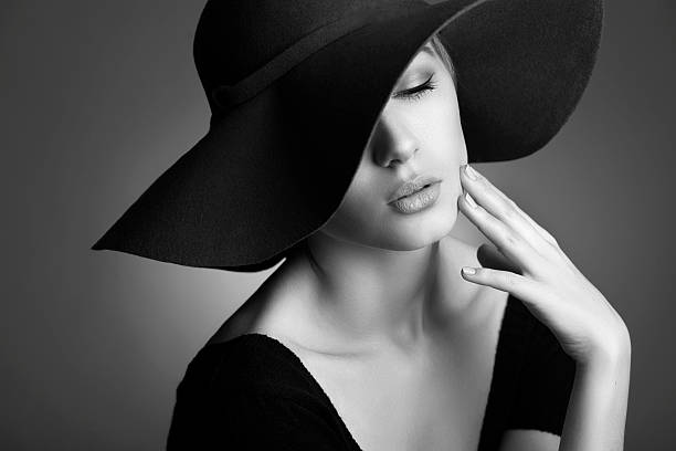 istock Young beautiful woman wearing black hat 467381781