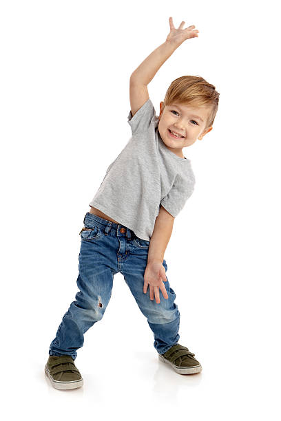 счастливый маленький мальчик на белом фоне - hand raised фотографии стоковые фото и изображения