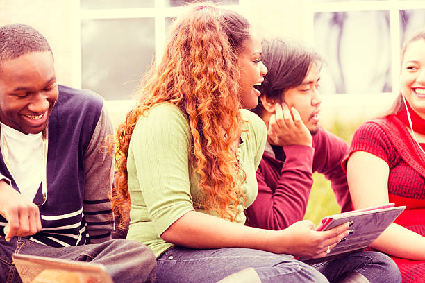 istock Education: Multi-ethnic group of college students hang out. Digital tablet. 467383925