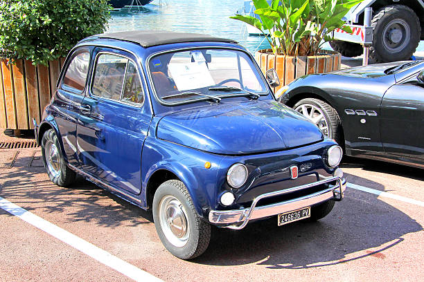 La Condamine, Monaco - August 2, 2014: Blue retro minicar Fiat 500 parked at the city street.