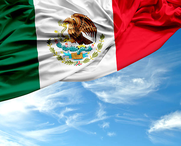 istock Mexican waving flag on beautiful day 467384674