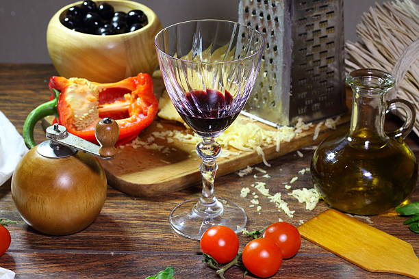 istock Pizza with red wineon wooden table 467384788