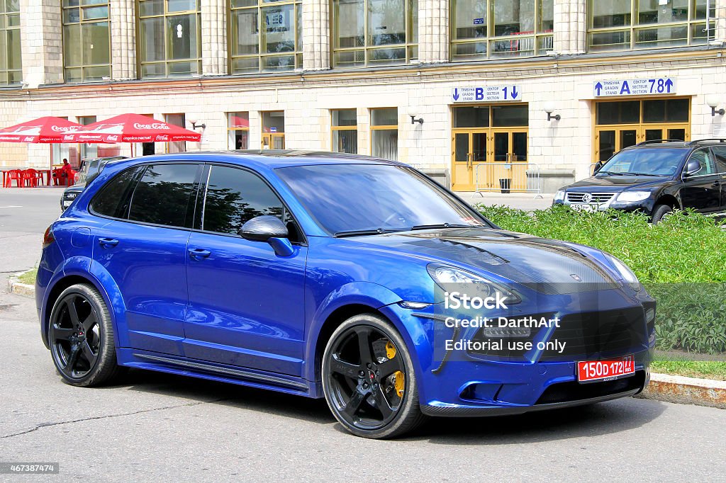 Porsche 958 Cayenne Moscow, Russia - July 7, 2012: Blue sportscar Porsche 958 Cayenne tuned by Mansory parked at the city street. Car Stock Photo