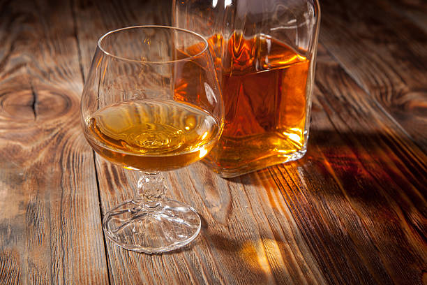 istock Bottle of brandy and a glass 467388038