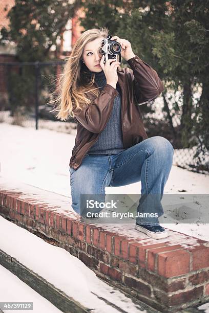 Young Woman Taking Photos Outdoors In Winter Stock Photo - Download Image Now - Adult, Blond Hair, Camera - Photographic Equipment