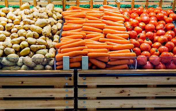 Fresh vegetables at farmers market, carrot, tomato and potato.
