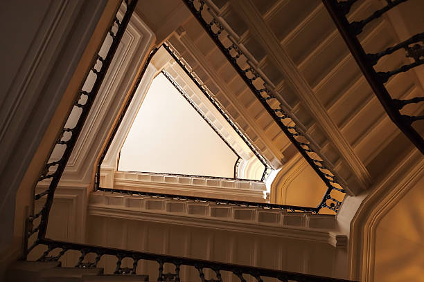 istock Triangle shaped flight of stairs, looking up 467395338