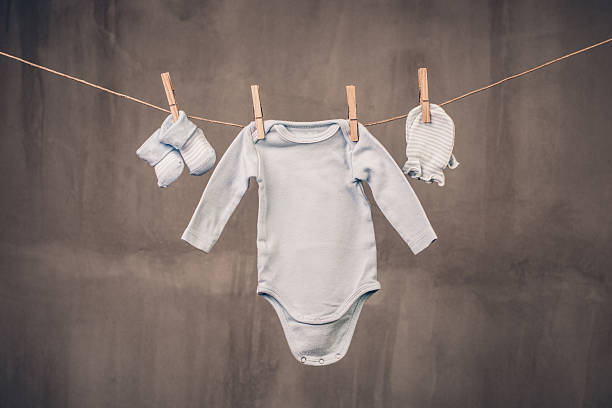 istock Baby clothes hanging on the clothesline 467395520
