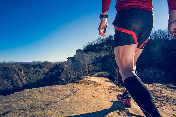 istock Man running on a trail on a hill 467398868