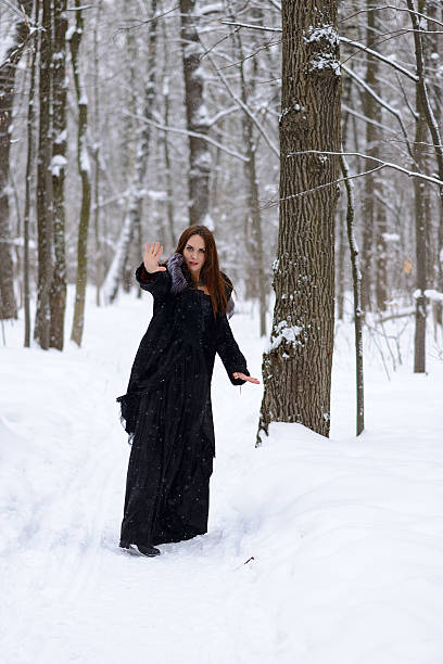 istock woman in winter forest 467399152
