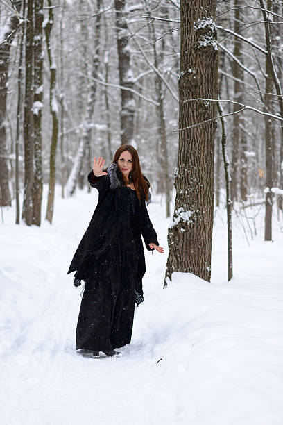istock woman in winter forest 467399154