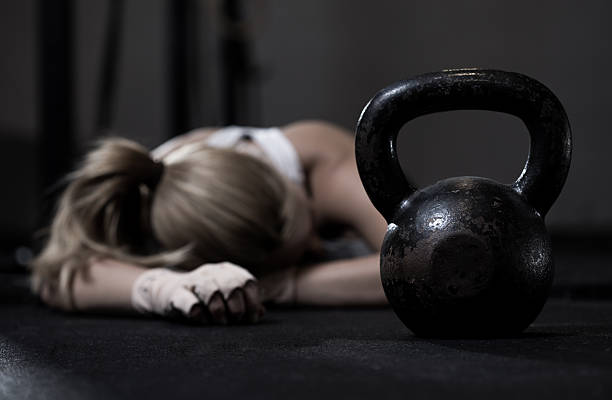 Girl after gym training Portrait of drained girl after hard gym training blonde female bodybuilders stock pictures, royalty-free photos & images