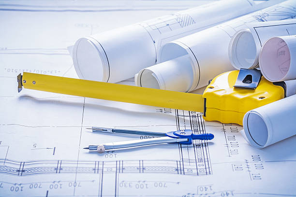 istock tapeline compass rolls of blueprints 467399284