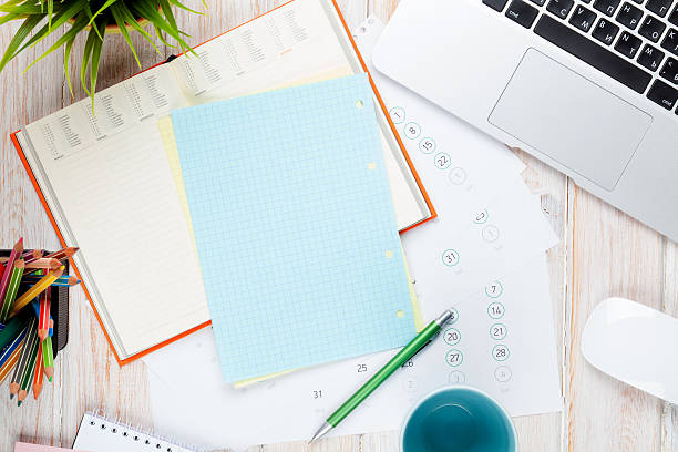 istock Office desk table with computer, supplies, coffee cup and flower 467399904