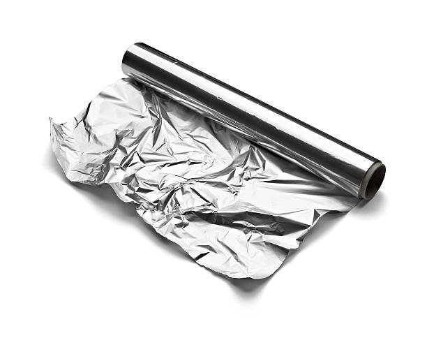 foglio di alluminio - rolled up foil paper gray foto e immagini stock