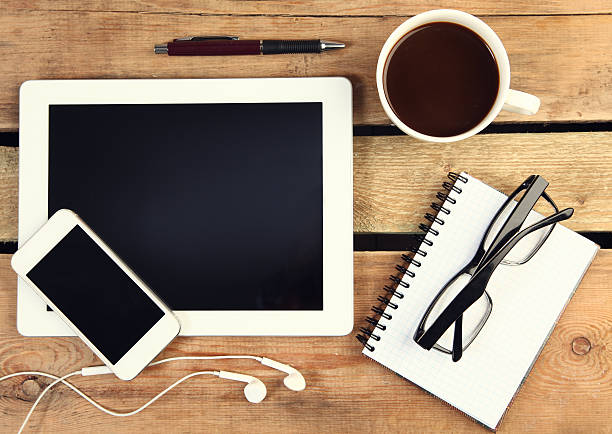 istock Overview of tablet, cell phone, coffee, glasses and notepad 467403084