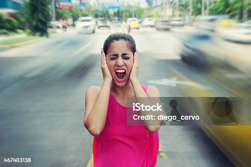 istock Portrait business woman screaming at street car traffic 467403138