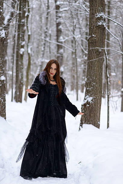 istock woman in winter forest 467403162
