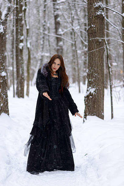 istock woman in winter forest 467403166