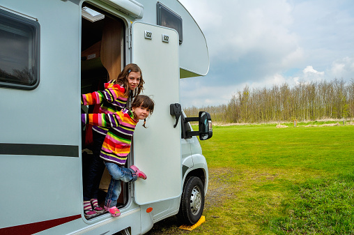Kids in camper (rv), family travel in motorhome on vacation