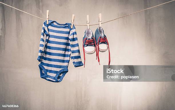 Baby Clothes Hanging On The Clothesline Stock Photo - Download Image Now - 2015, Baby - Human Age, Beautiful People