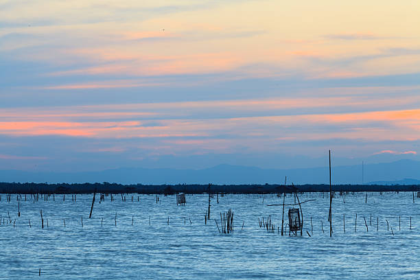 istock Wooden pier on a blue lake sunset and cloudy sk 467413549