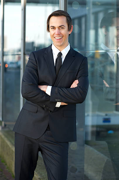 istock Confident young business man smiling outdoors 467413739