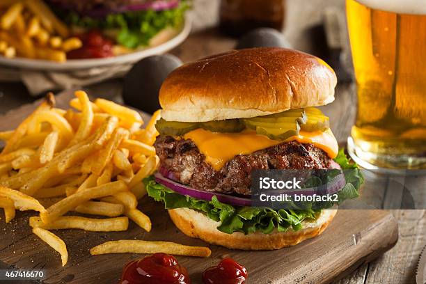 Huge Grass Fed Bison Hamburger With Chips Beer Stock Photo - Download Image Now - Burger, French Fries, Cheeseburger
