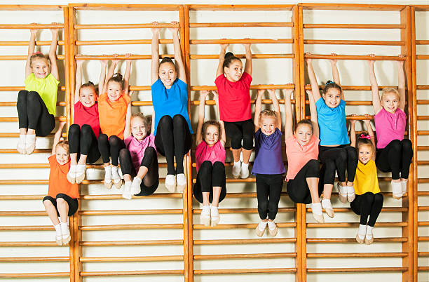 Happy sporty children in gym stock photo