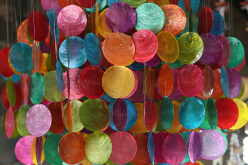 A very colourful wind chime made of colourful pieces of sea shells - excellent as an abstract background.