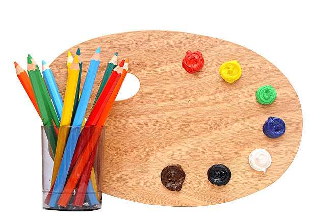 istock wooden artists palette loaded with various colour paints 467429229