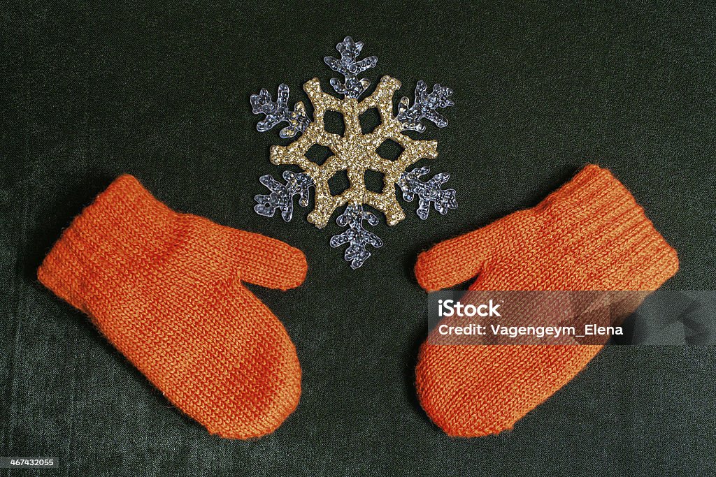 Mittens and snowflake Mittens and snowflake on a textile backing christmas background close up shot Backdrop - Artificial Scene Stock Photo