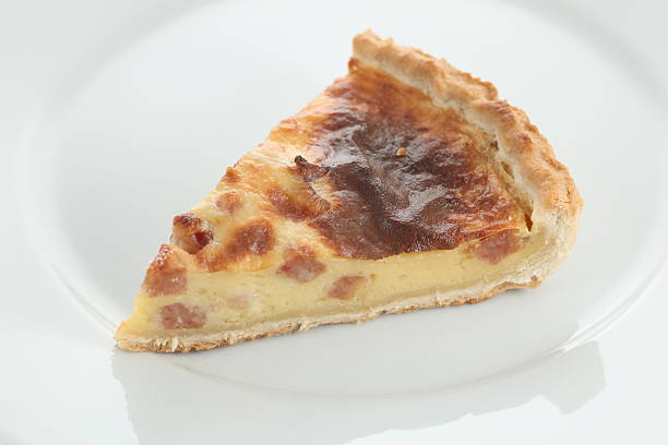 istock Fresh baked slice of quiche lorraine on a plate 467432379