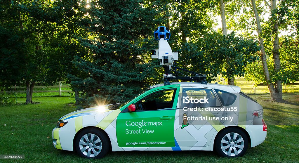 Google street view camera car Red deer, AB, Canada - August 27, 2014: Google street view car making its rounds with the 2014 Google maps update.  Google - Brand-name Stock Photo