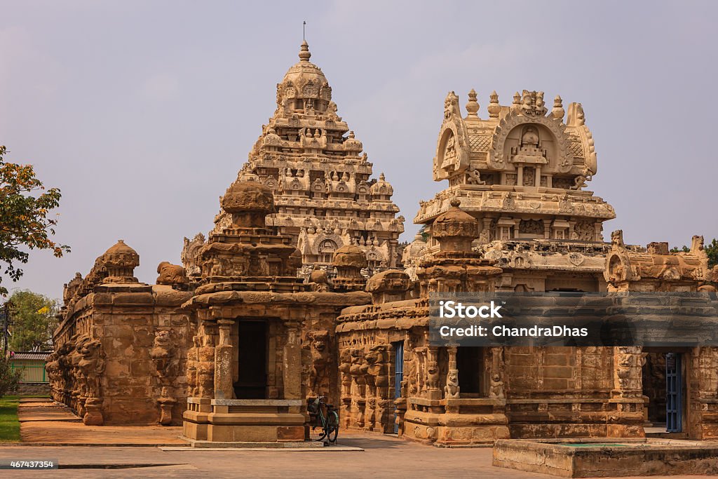 Kanchipuram, India: The 1300 Year Old Kailasanathar Hindu Temple Built By The Pallava King Narasimhavarman II Between 685-705 AD Built on the banks of the Vedavathi River, the Kailasanathar Temple is the oldest structure in the Tamil Nadu city of Kanchipuram in South India.  Built by the Pallava King Rajasimha also known as Narasimhavarman II, in the Dravidian style of architecture, it is carved and sculpted mostly out of sandstone. It was built between 685 and 705 AD and is dedicated to the god Shiva. Photo shot in the afternoon sunlight; horizontal format. No people. Temple - Building Stock Photo
