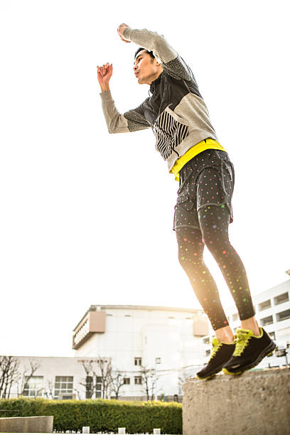 istock Japanese man jumping high on the city 467437414