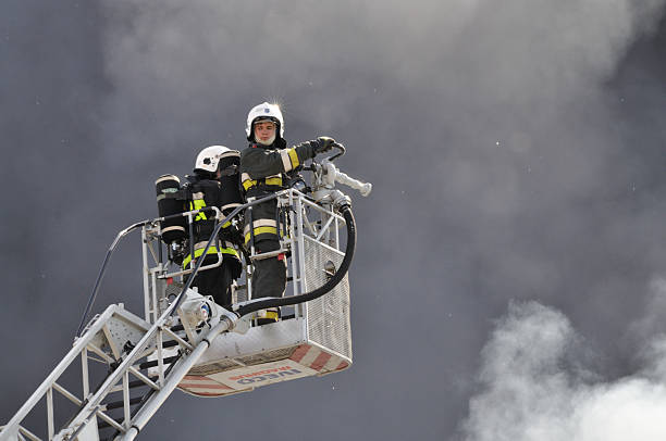 Firefighter crews battling storehouse fire stock photo