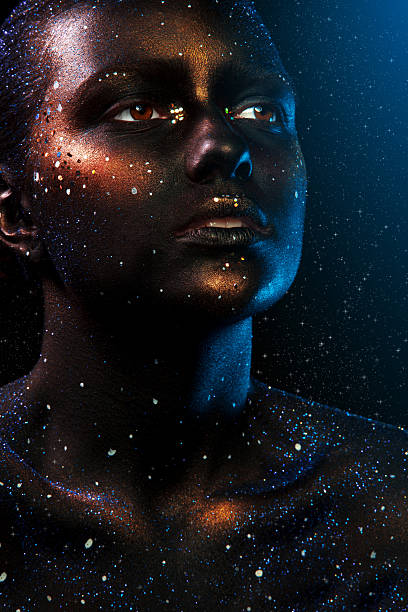 istock woman face with dark make up and stars 467439087