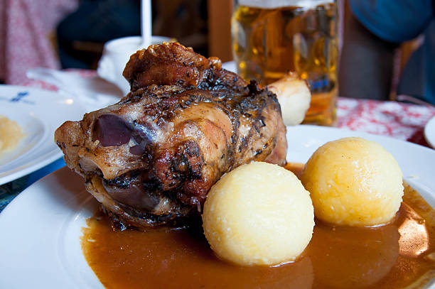 istock roasted pork knuckle and gravy with mashed potatoes 467439169