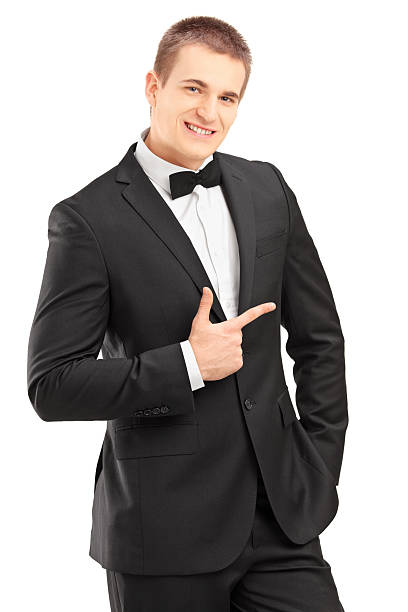istock Handsome stylish male in bow tie suit pointing 467439725