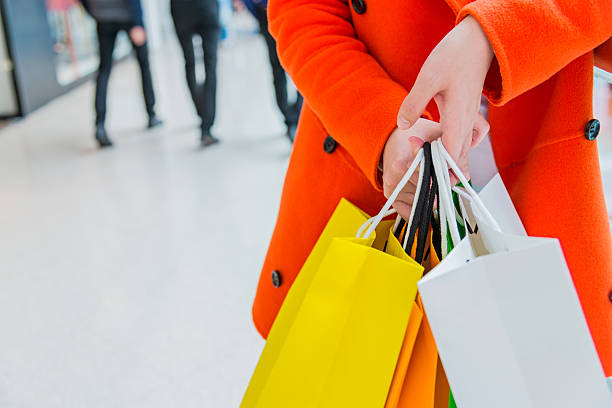 istock holding shopping bags 467440176