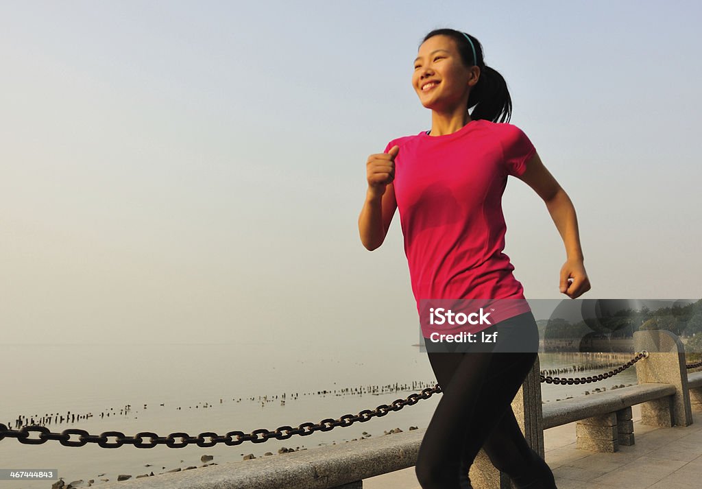 healthy lifestyle beautiful asian woman running at seaside park Active Lifestyle Stock Photo