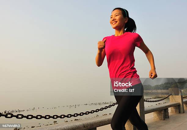 Healthy Lifestyle Beautiful Asian Woman Running At Seaside Park Stock Photo - Download Image Now
